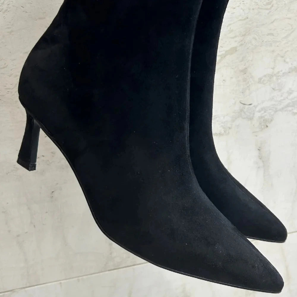 Black suede ankle boots with low heels